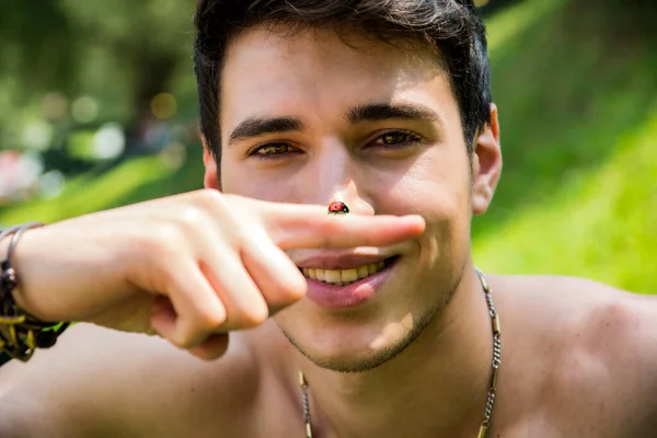 Young Handsome Shirtless Male Looking Camera Holding Ladybird Ladybug Finger — Stock Photo, Image