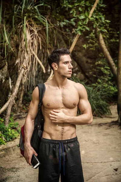 Young Muscular Topless Man Backpack Phone Looking Away Background Tropical — Stock Photo, Image