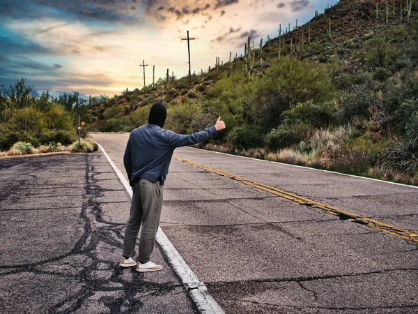 Back Young Man Hitchhiker Waiting Car Roadside City Wearing Hoodie — Stock Photo, Image