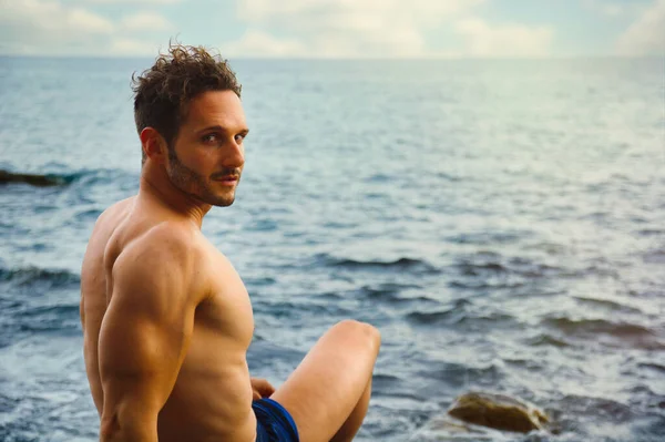 Attractive Muscular Shirtless Athletic Man Sitting Next Water Sea Ocean — Stock Photo, Image