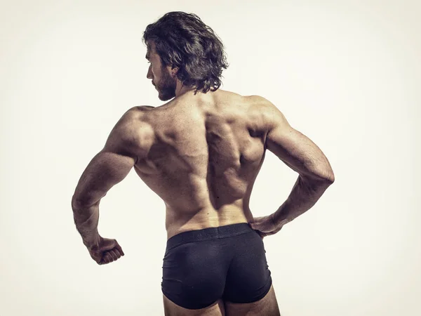 Snygg Manlig Kroppsbyggare Gör Klassisk Bodybuilding Tillbaka Pose Tittar Kameran — Stockfoto