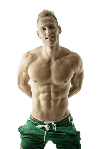 Attractive Shirtless Blond Male Bodybuilder Shorts Indoors Dark