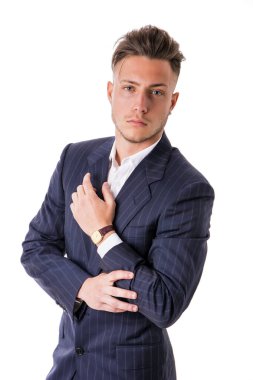 Shot of handsome elegant young man with suit and neck-tie, isolated on white, looking at camera