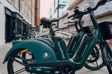 London, UK - February 02, 2023: Human Forest bikes parked on a street in Barbican,London. The bikes are built with sustainability at their core and are available in selected London boroughs from 2021.