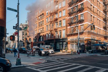 New York, USA - November 21, 2022: Cars on a street in Little Italy, a neighborhood in Lower Manhattan in New York City, known for its large Italian population.