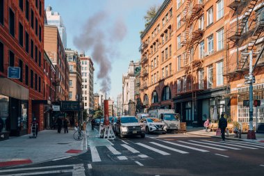New York, USA - November 21, 2022: Cars on a street in Little Italy, a neighborhood in Lower Manhattan in New York City, known for its large Italian population.