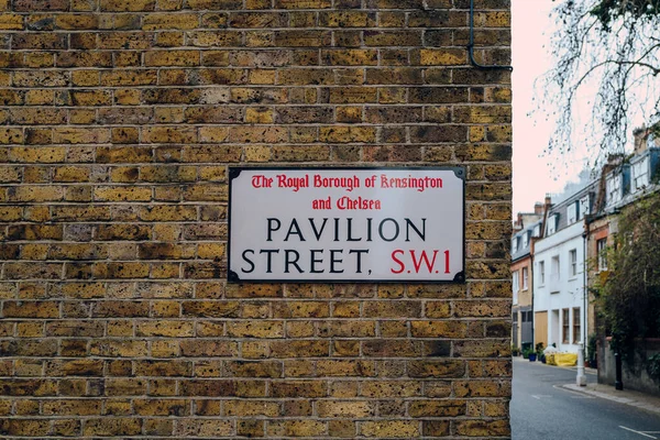 Street name sign on a wall of a building on Pavilion Street in The Royal Borough of Kensington and Chelsea, London, UK.