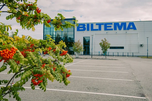 stock image Helsinki, Finland - August 22, 2022: BILTEMA store. Blue sign above main entrance to building. Car parking in front exterior facade of store