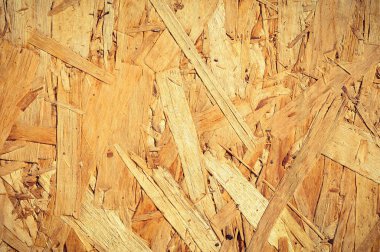 OSB board close up view. Chipboard background.