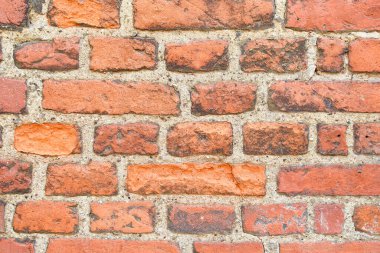 Kabaca inşa edilmiş kırmızı tuğla duvar arkaplanı.