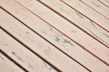 Aged pink wood planks background.