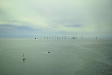 Wind turbines in the sea in Scandinavia. clipart