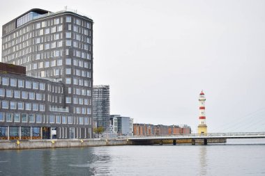 Malmo University building reflected in water. clipart