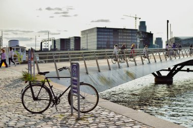 Copenhagen, Denmark. January 7, 2025. Parked bicycle near the bridge in Copenhagen, Denmark. clipart