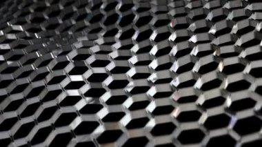 Abstract metallic background, floating hexagonal grid, endless geometric field on black background. Creative 3d modern background, imitation of an unknown metal from space.