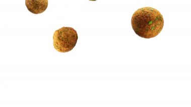 Falafel - nohut, otlar ve baharatların karışımı beyaz arka planda yavaş çekimde düşüyor. Sokak yemeği, vejetaryen yemeği. Yüksek kalite 4k görüntü.