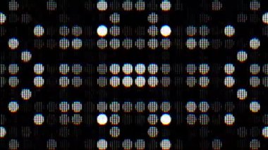Karanlık bir arkaplandaki noktalar dizisi detaylı bir LED panel arızasını temsil ediyor. Yüksek kaliteli FullHD görüntüler.