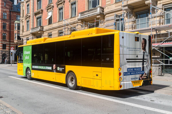 Copenhagen, Denmark - July 26, 2022: Yellow city bus in Copenhagen. Bus of public transport.