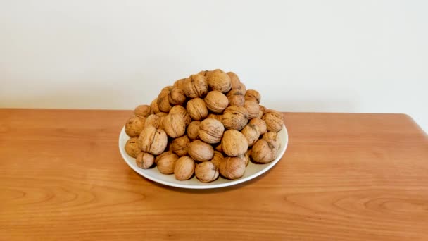 Many Walnuts Shell White Plate — Stock Video