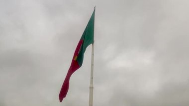 Huge portuguese flag. Portuguese flag waving in the wind.