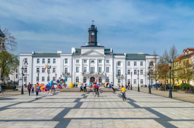 Plock, Poland - April 7, 2024: The Town Hall (Municipal Office of Plock) at Old Market Square. clipart