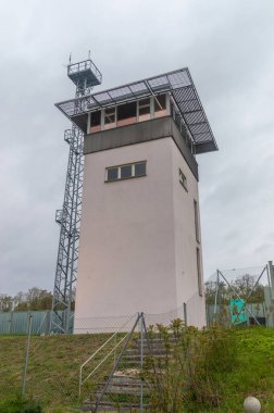 Harbke, Germany - April 19, 2024: Watch tower in the exit area of the Marienborn border crossing. clipart