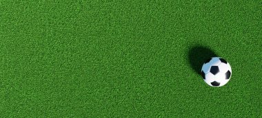 Yeşil çimlerin üzerinde panorama arka planı olarak futbol topu, pankart boyutu