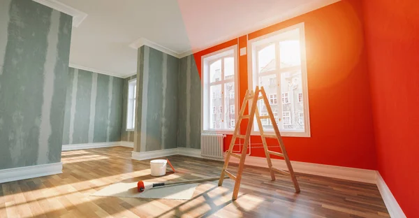stock image Painting wall red in room before and after restoration or refurbishment