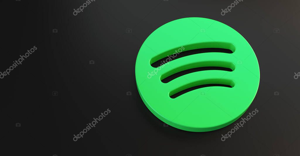 BERLIN, GERMANY JUNE 2021: Spotify logo for web sites, mobile applications, banners, printed on dark black plastic background. Spotify is an online streaming audio service.