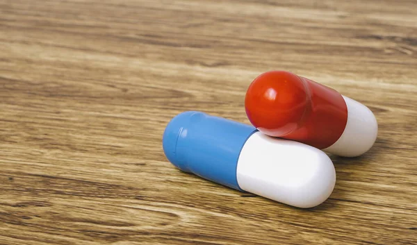 Two Medical Capsules Table — Stock Photo, Image