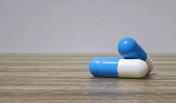 Medizin Blaue Pillen Oder Kapseln Auf Einem Holztisch Mit Kopierraum — Stockfoto