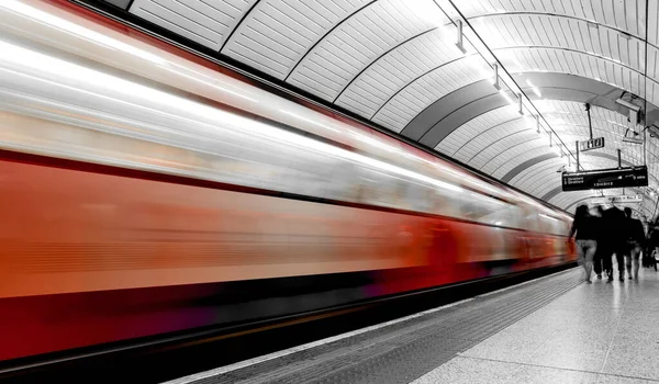 Stock image subway train in motion arriving at a London underground train station