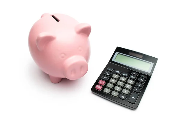 Piggybank Com Uma Calculadora Preta Sobre Fundo Branco Imagens Royalty-Free