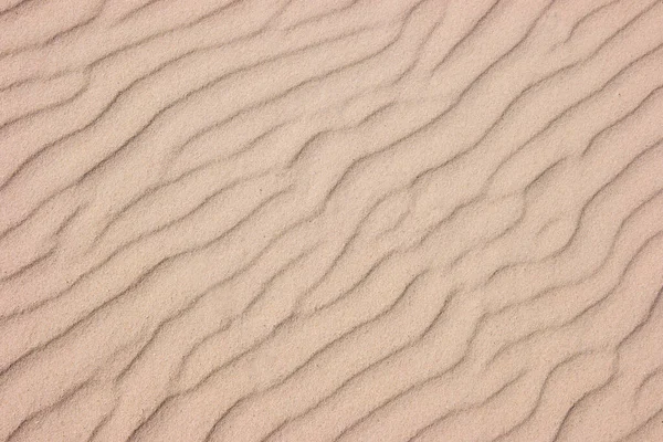 茶色の砂のテクスチャビーチの砂からの背景 — ストック写真