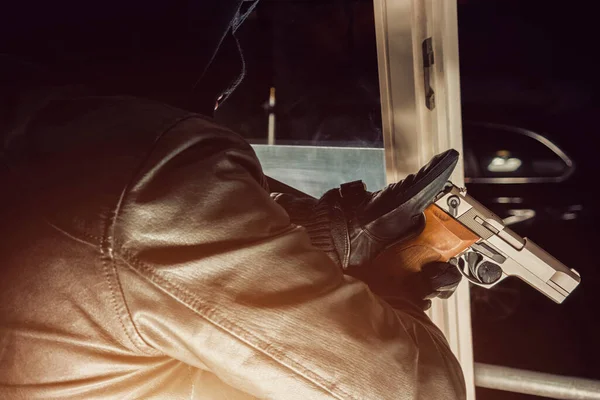 Burglar Pointing Gun Out Window — Stock Photo, Image