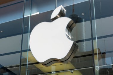 FRANKFURT, GERMANY MARCH, 2017: Apple logo on a Apple store. Apple is the multinational technology company headquartered in Cupertino, California and sells consumer electronics products. clipart