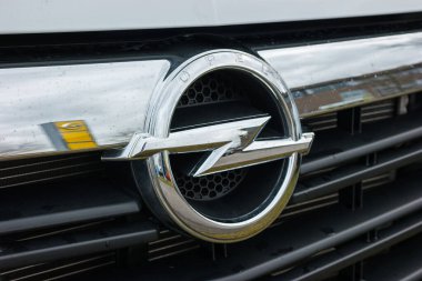 AACHEN, GERMANY FEBRUARY, 2017: Opel logo on a car grilll. Opel AG is a German automobile manufacturer and a subsidiary of the American General Motors Company. clipart