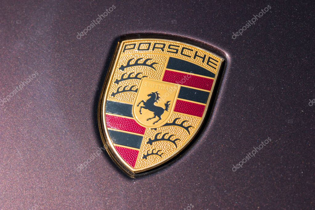 AACHEN, GERMANY MARCH, 2017: Porsche Sign Close Up on a car. Ferdinand Porsche founded the company in 1931 with main offices in the centre of Stuttgart.