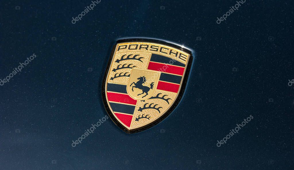 AACHEN, GERMANY MARCH, 2017: Porsche Logo Close Up on a black car. Ferdinand Porsche founded the company in 1931 with main offices in the centre of Stuttgart.
