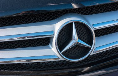 AACHEN, GERMANY FEBRUARY, 2017: Mercedes Benz logo close up on a car grill. Mercedes-Benz is a German automobile manufacturer. The brand is used for luxury automobiles, buses, coaches and trucks. clipart