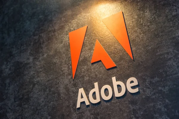 stock image COLOGNE, GERMANY SEPTEMBER, 2017: Adobe Systems Logo. Adobe is a multinational software company that produces and sells multimedia and creativity software.