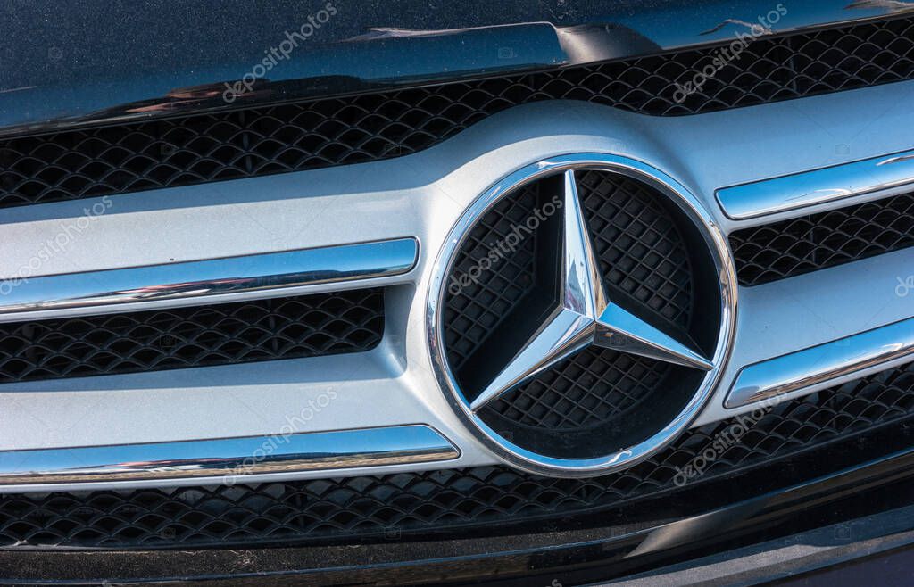 AACHEN, GERMANY FEBRUARY, 2017: Mercedes Benz logo close up on a car grill. Mercedes-Benz is a German automobile manufacturer. The brand is used for luxury automobiles, buses, coaches and trucks.