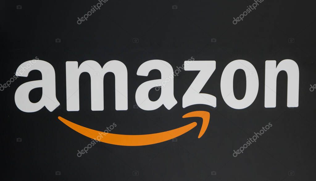 COLOGNE, GERMANY SEPTEMBER, 2017: Amazon Logo on black background. Amazon is an American electronic e-commerce company distribution worlwide.