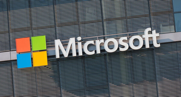 COLOGNE, GERMANY OCTOBER, 2017: Microsoft logo on a wall. Microsoft is an international corporation that develops, supports and sells computer software and services worldwide.