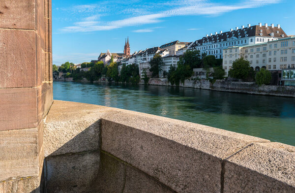 View of the ald town of Basel with red stone Munster cathedral on the Rhine river at summer, Switzerland