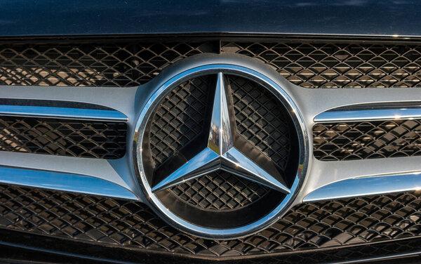 AACHEN, GERMANY FEBRUARY, 2017: Mercedes Benz logo close up. Mercedes-Benz is a German automobile manufacturer. The brand is used for luxury automobiles, buses, coaches and trucks.