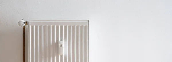 radiator on a white wall, banner size, with copyspace for your individual text.