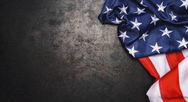 American flag freely lying on metallic board.
