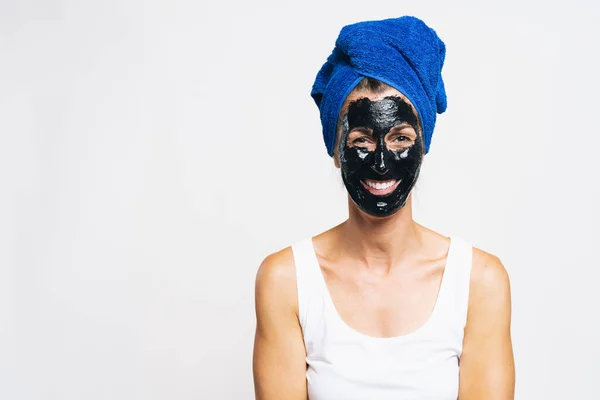 Woman Purifying Black Mask Her Face Wrapped Bath Towel Head — Stock Photo, Image