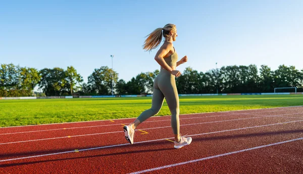 Side View Woman Running Track Sunlight Stock Image